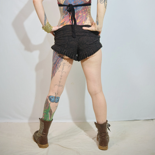 Woman's High Waist Ruffle Shorts Black and Orange Galaxy