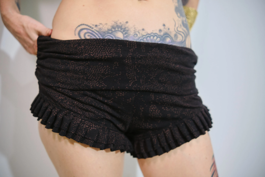 Woman's High Waist Ruffle Shorts Black and Orange Galaxy