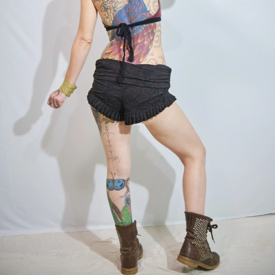 Woman's High Waist Ruffle Shorts Black and Orange Galaxy